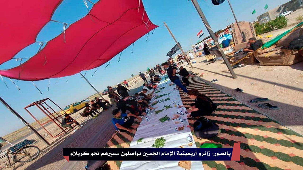 بالصور: زائرو أربعينية الإمام الحسين يواصلون مسيرهم نحو كربلاء